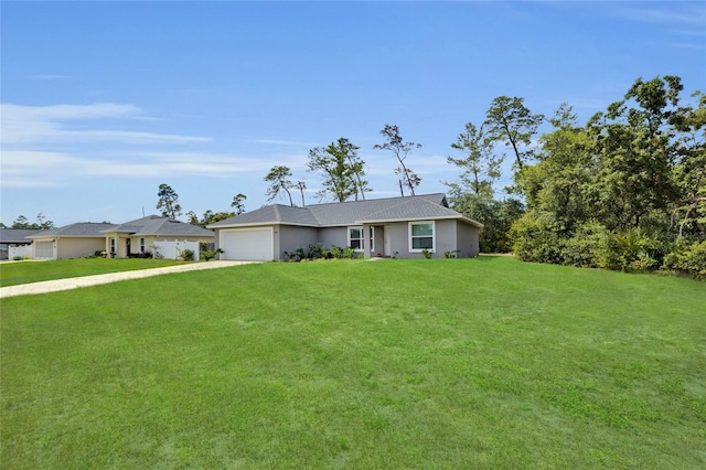4501 SW 159th Street Rd, Ocala, FL 34473 - ranch-style house featuring a garage, driveway, a front yard, and stucco siding
