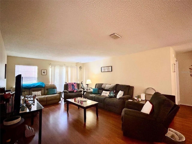 3525 E Fort King St Unit 140, Ocala, FL 34470 - living area with a textured ceiling and wood finished floors