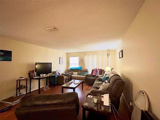 3525 E Fort King St Unit 140, Ocala, FL 34470 - living area with wood finished floors and a textured ceiling