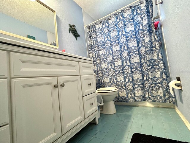 3525 E Fort King St Unit 140, Ocala, FL 34470 - bathroom with tile patterned flooring, vanity, a textured ceiling, curtained shower, and a textured wall