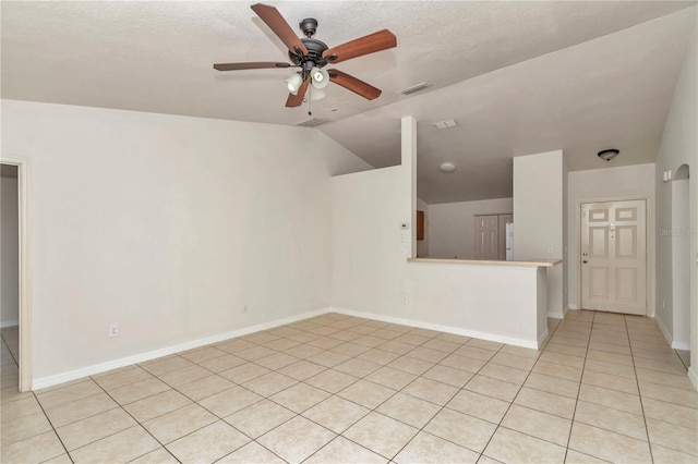 15711 SW 52nd Avenue Rd, Ocala, FL 34473 - unfurnished room with a ceiling fan, light tile patterned floors, lofted ceiling, and a textured ceiling