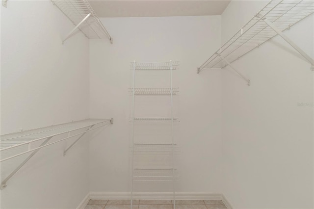 15711 SW 52nd Avenue Rd, Ocala, FL 34473 - walk in closet with light tile patterned flooring