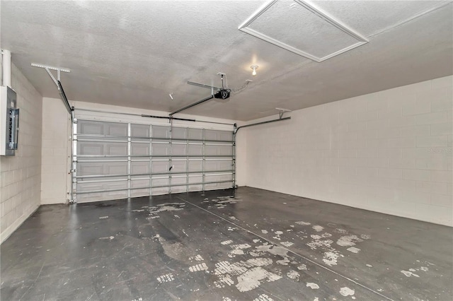 15711 SW 52nd Avenue Rd, Ocala, FL 34473 - garage featuring a garage door opener and concrete block wall