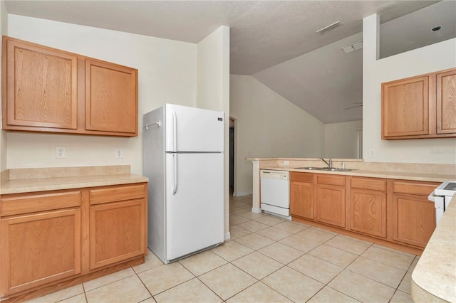 15711 SW 52nd Avenue Rd, Ocala, FL 34473 - kitchen featuring white appliances, light countertops, vaulted ceiling, light tile patterned floors, and a peninsula