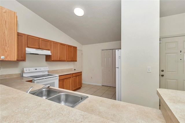 15711 SW 52nd Avenue Rd, Ocala, FL 34473 - kitchen with white appliances, under cabinet range hood, vaulted ceiling, light tile patterned floors, and light countertops