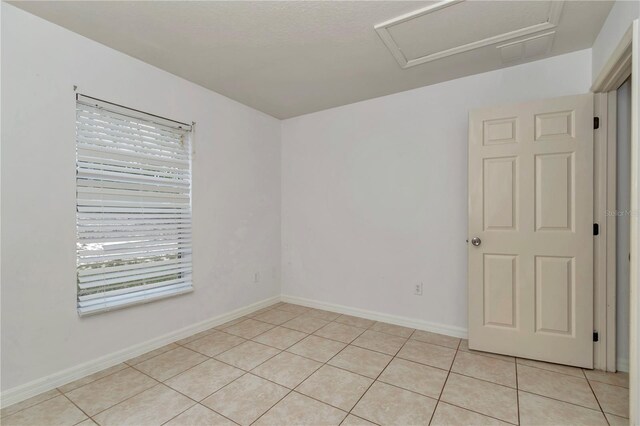 15711 SW 52nd Avenue Rd, Ocala, FL 34473 - empty room featuring attic access and light tile patterned flooring