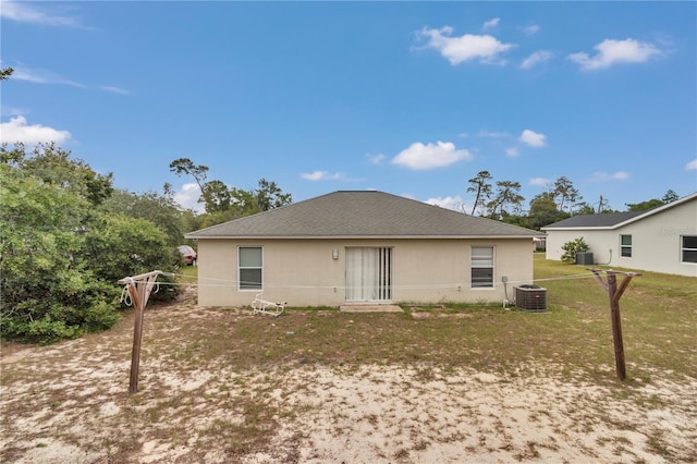 15711 SW 52nd Avenue Rd, Ocala, FL 34473 - rear view of house featuring stucco siding, a lawn, and a shingled roof