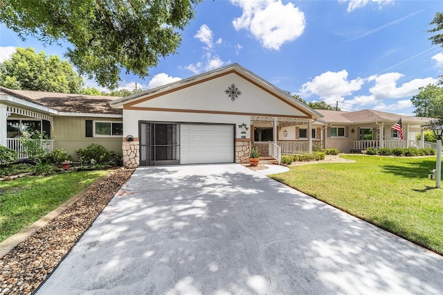 8881 SW 94th St Unit E, Ocala, FL 34481 - single story home with an attached garage, stucco siding, driveway, a front yard, and covered porch