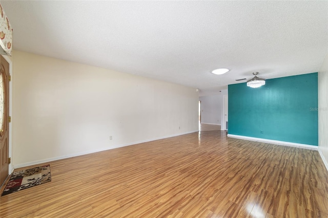 8881 SW 94th St Unit E, Ocala, FL 34481 - spare room featuring light wood-style flooring and a textured ceiling