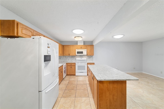 8881 SW 94th St Unit E, Ocala, FL 34481 - kitchen featuring white appliances, a kitchen island, light countertops, a textured ceiling, and tasteful backsplash