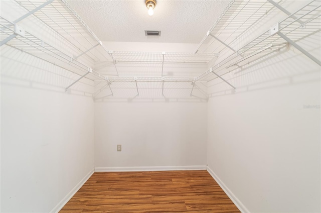 8881 SW 94th St Unit E, Ocala, FL 34481 - walk in closet with wood finished floors