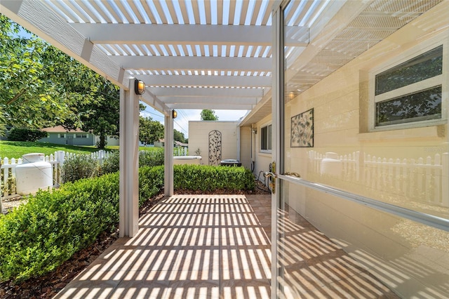 8881 SW 94th St Unit E, Ocala, FL 34481 - view of patio / terrace featuring a pergola