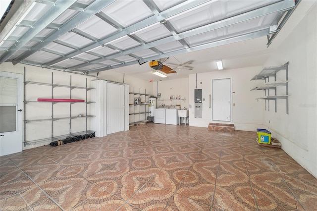 8881 SW 94th St Unit E, Ocala, FL 34481 - garage featuring a garage door opener, independent washer and dryer, and water heater