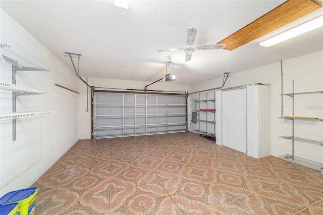 8881 SW 94th St Unit E, Ocala, FL 34481 - garage with a ceiling fan and a garage door opener