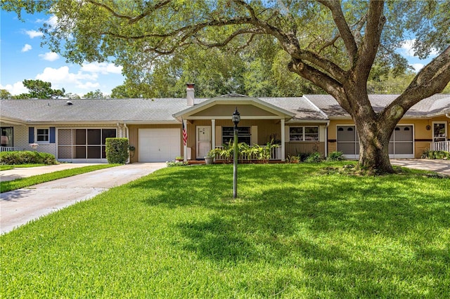 8850 SW 97th St Unit C, Ocala, FL 34481 - single story home with a garage, a front yard, concrete driveway, and a chimney
