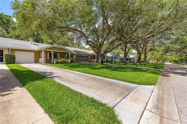 8850 SW 97th St Unit C, Ocala, FL 34481 - ranch-style house featuring an attached garage, concrete driveway, a front yard, and a chimney