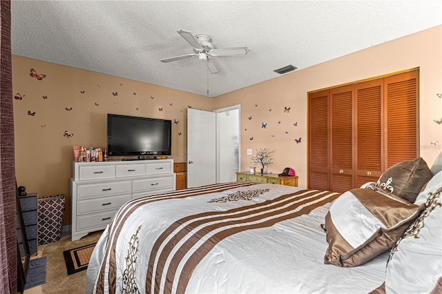 8850 SW 97th St Unit C, Ocala, FL 34481 - bedroom with light colored carpet, a closet, a textured ceiling, and a ceiling fan