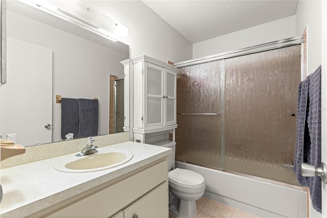 8850 SW 97th St Unit C, Ocala, FL 34481 - bathroom with vanity, combined bath / shower with glass door, a textured ceiling, and tile patterned floors