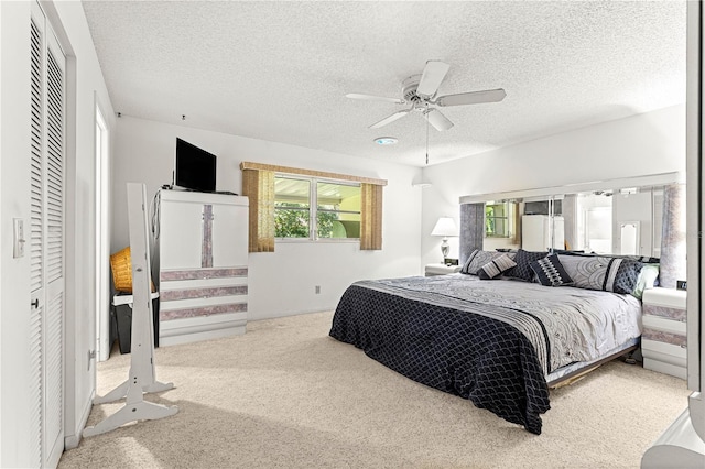 8850 SW 97th St Unit C, Ocala, FL 34481 - bedroom featuring carpet flooring, a textured ceiling, and ceiling fan