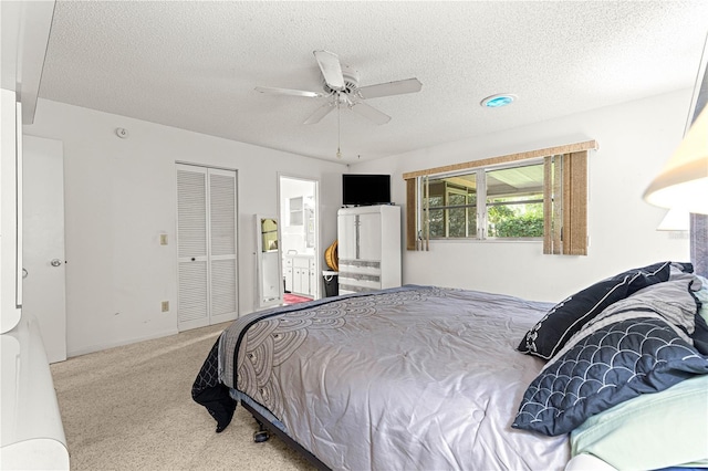8850 SW 97th St Unit C, Ocala, FL 34481 - carpeted bedroom with a textured ceiling, a ceiling fan, and a closet