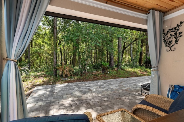 7242 SW 115th Pl, Ocala, FL 34476 - view of patio featuring a wooded view