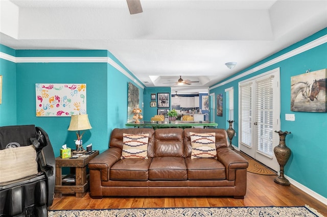 7242 SW 115th Pl, Ocala, FL 34476 - living area featuring a ceiling fan, wood finished floors, and a raised ceiling