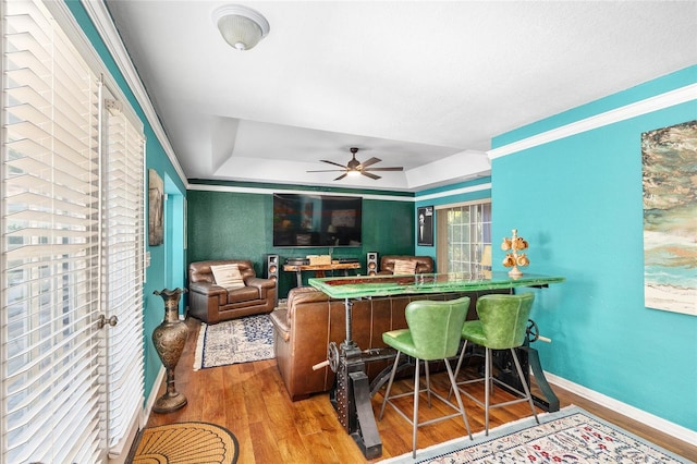 7242 SW 115th Pl, Ocala, FL 34476 - bar featuring wood finished floors, ceiling fan, and a raised ceiling
