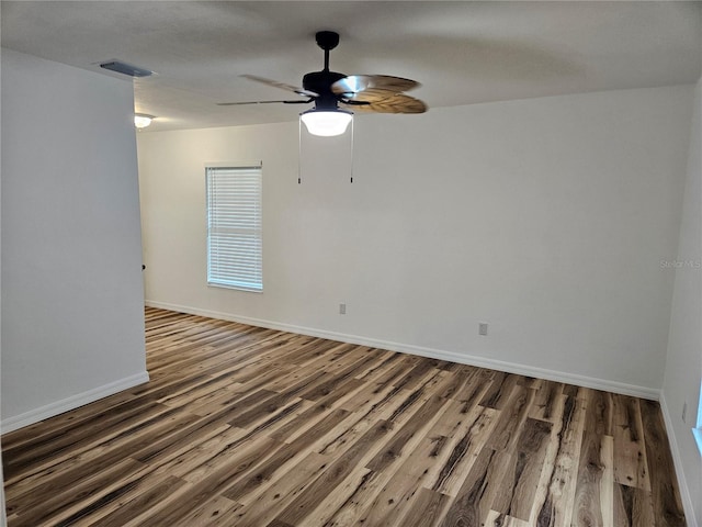 51 NE 10th St, Williston, FL 32696 - unfurnished room featuring wood finished floors and a ceiling fan
