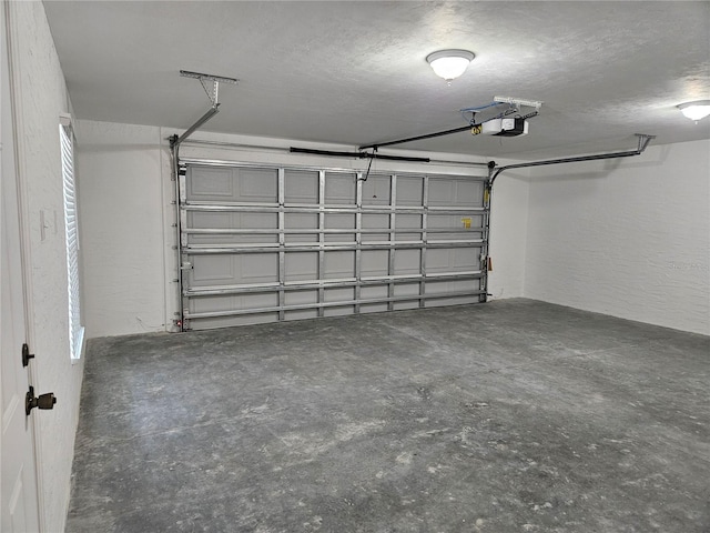 51 NE 10th St, Williston, FL 32696 - garage with a textured wall and a garage door opener