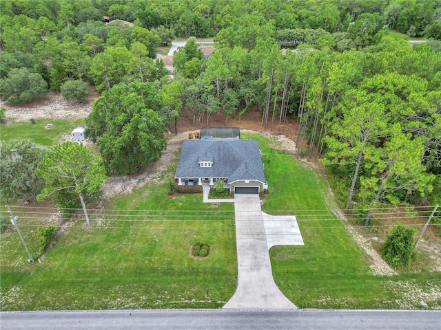 3196 W Mustang Blvd, Beverly Hills, FL 34465 - view from above of property with a forest