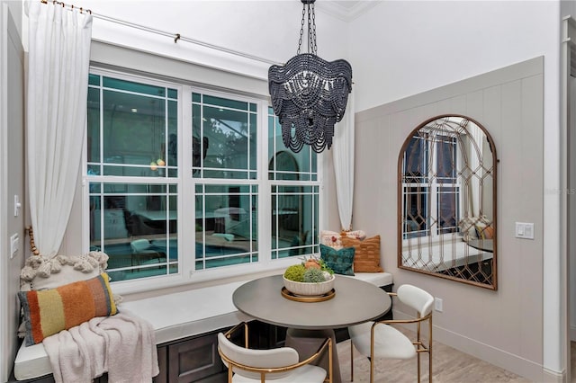 3196 W Mustang Blvd, Beverly Hills, FL 34465 - dining space featuring ornamental molding, a wainscoted wall, and a chandelier