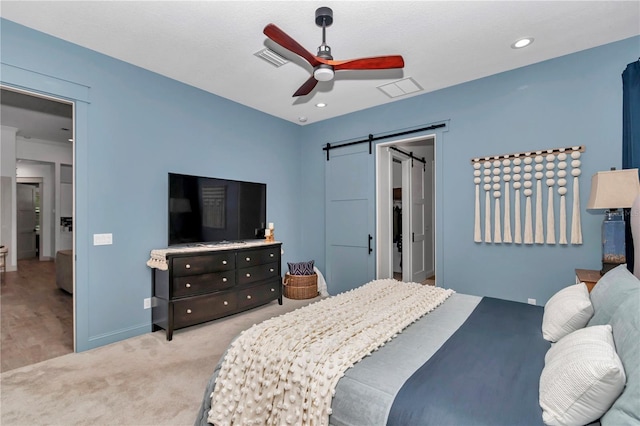 3196 W Mustang Blvd, Beverly Hills, FL 34465 - carpeted bedroom with a barn door, ceiling fan, a walk in closet, and recessed lighting