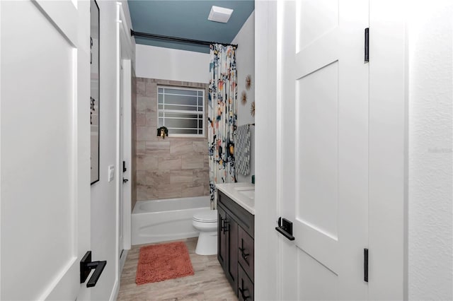 3196 W Mustang Blvd, Beverly Hills, FL 34465 - full bath with shower / bath combo with shower curtain, vanity, and wood finished floors