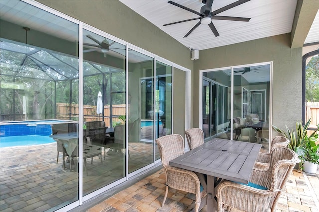 3196 W Mustang Blvd, Beverly Hills, FL 34465 - sunroom with a ceiling fan, a swimming pool, and outdoor dining area