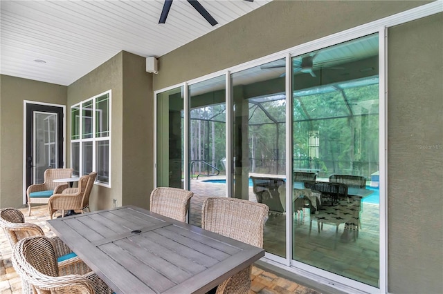 3196 W Mustang Blvd, Beverly Hills, FL 34465 - view of patio / terrace with ceiling fan, an outdoor pool, and glass enclosure