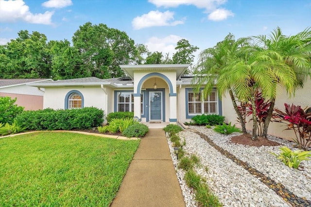 3769 Grove View Ln, Port Orange, FL 32129 - view of front of property featuring stucco siding and a front yard