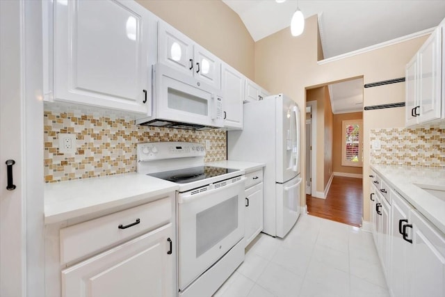3769 Grove View Ln, Port Orange, FL 32129 - kitchen featuring white appliances, white cabinets, light countertops, lofted ceiling, and crown molding