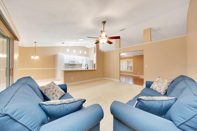 3769 Grove View Ln, Port Orange, FL 32129 - living room featuring light carpet, lofted ceiling, and a ceiling fan