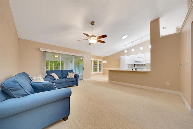 3769 Grove View Ln, Port Orange, FL 32129 - living room featuring ceiling fan, lofted ceiling, and light carpet