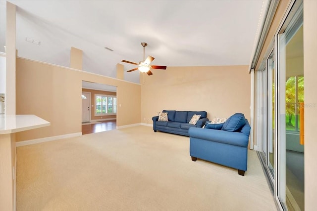 3769 Grove View Ln, Port Orange, FL 32129 - carpeted living area featuring ceiling fan and vaulted ceiling