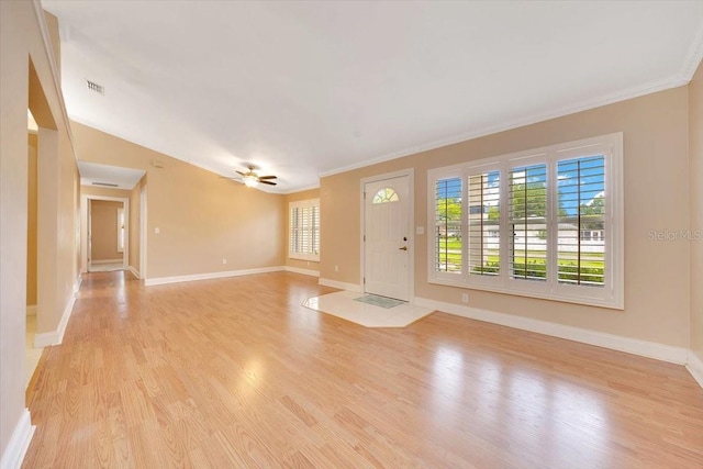3769 Grove View Ln, Port Orange, FL 32129 - foyer featuring light wood-type flooring, ornamental molding, and a ceiling fan