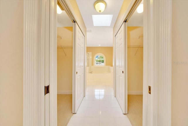 3769 Grove View Ln, Port Orange, FL 32129 - hallway with baseboards and light tile patterned floors