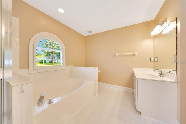 3769 Grove View Ln, Port Orange, FL 32129 - bathroom featuring vanity, a bath, and tile patterned flooring