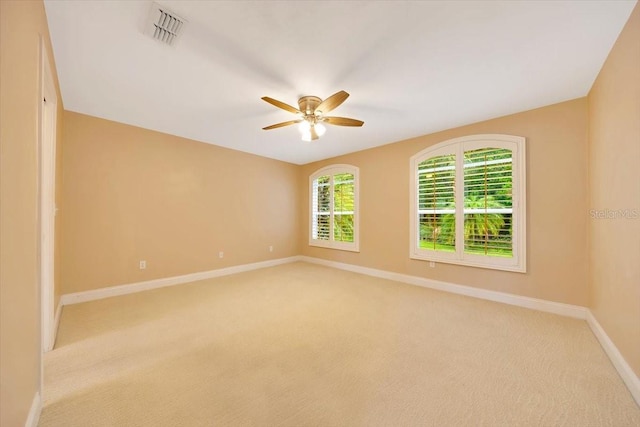 3769 Grove View Ln, Port Orange, FL 32129 - empty room featuring ceiling fan and light carpet