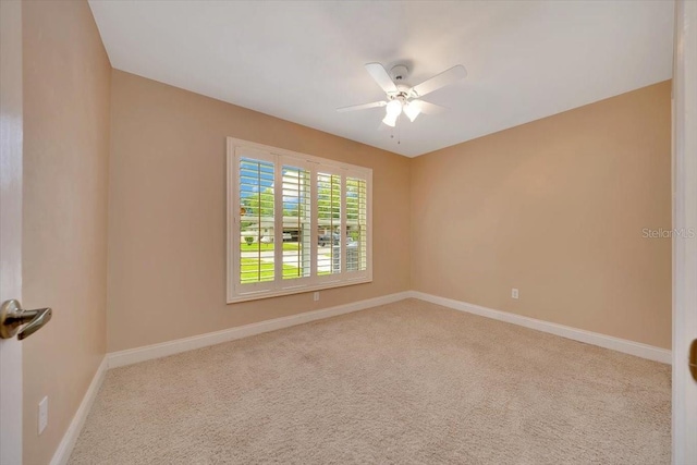 3769 Grove View Ln, Port Orange, FL 32129 - carpeted spare room with a ceiling fan and baseboards