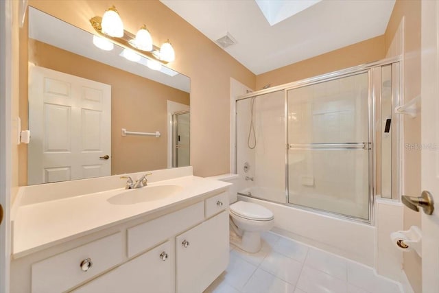 3769 Grove View Ln, Port Orange, FL 32129 - bathroom featuring vanity, combined bath / shower with glass door, tile patterned flooring, and a skylight