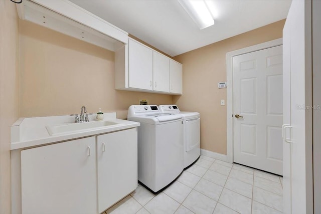 3769 Grove View Ln, Port Orange, FL 32129 - washroom featuring cabinet space, washing machine and dryer, and light tile patterned flooring