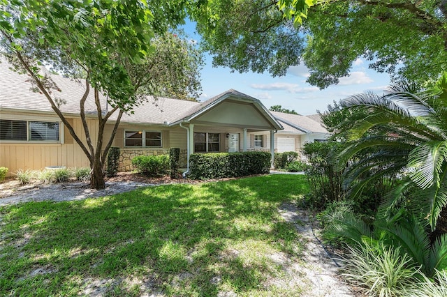 9065 SW 82nd Ter Unit G, Ocala, FL 34481 - ranch-style home with a front lawn, stone siding, and a garage
