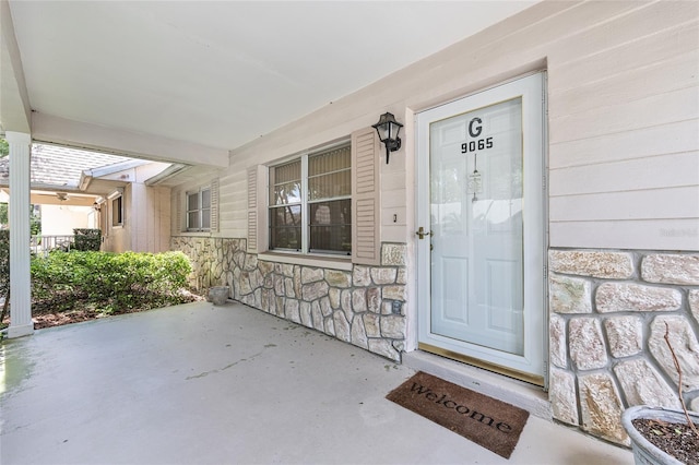 9065 SW 82nd Ter Unit G, Ocala, FL 34481 - entrance to property with stone siding and a porch