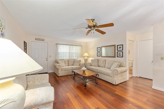 9065 SW 82nd Ter Unit G, Ocala, FL 34481 - living room featuring wood finished floors, ceiling fan, and a textured ceiling